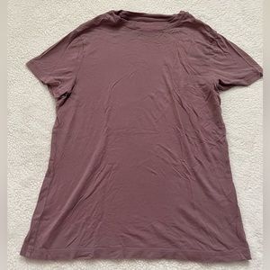Basic dusty pink shirt. It’s a size x small.